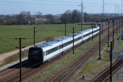 Ic3 trainset MFA 5051/MFB 5251 (named Niels Kjeldsen) and behind IR4 photographed in Taulov,  19. April 2015.  The Ic3 was built by ABB Scandia in Denmark. Each unit consists of 3 coaches. Built in a number of 92 trainsets. The trainsets were put in service in 1989 - 1998. 4 diesel engines of 294 kW per trainset. Max speed 180 km/h - 112 mph. Length 58 800 mm. Weight 97 metric tonnes. 16 seats 1st class, 128 seats 2nd class. Up to 5 trainsets can be put together. The MFA 5051/MFB 5251 was put in service in 1991.