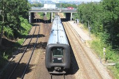 Ic3 trainset MFA 5007/MFB 5207 (named Jomfru Ane) photographed in Kongsvang by Aarhus 18. August 2005.  The Ic3 was built by ABB Scandia in Denmark. Each unit consists of 3 coaches. Built in a number of 92 trainsets. The trainsets were put in service in 1989 - 1998. 4 diesel engines of 294 kW per trainset. Max speed 180 km/h - 112 mph. Length 58 800 mm. Weight 97 metric tonnes. 16 seats 1st class, 128 seats 2nd class. Up to 5 trainsets can be put together. The MFA 5007/MFB 5207 was put in service in 1989.