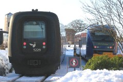Ic3 trainset MFA 5029/MFB 5229 (named Jens Vejmand) photographed at the railwaystation in Hjørring 28. january 2006.  The Ic3 was built by ABB Scandia in Denmark. Each unit consists of 3 coaches. Built in a number of 92 trainsets. The trainsets were put in service in 1989 - 1998. 4 diesel engines of 294 kW per trainset. Max speed 180 km/h - 112 mph. Length 58 800 mm. Weight 97 metric tonnes. 16 seats 1st class, 128 seats 2nd class. Up to 5 trainsets can be put together. The MFA 5029/MFB 5229 was put in service in 1991.