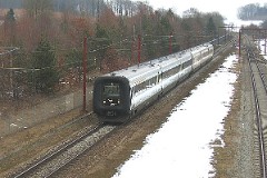 Ic3 trainset MFA 5037/MFB 5237 (named Doktor Larsen) photographed by Tommerup 17. March 2006.  The Ic3 was built by ABB Scandia in Denmark. Each unit consists of 3 coaches. Built in a number of 92 trainsets. The trainsets were put in service in 1989 - 1998. 4 diesel engines of 294 kW per trainset. Max speed 180 km/h - 112 mph. Length 58 800 mm. Weight 97 metric tonnes. 16 seats 1st class, 128 seats 2nd class. Up to 5 trainsets can be put together. The MFA 5003/MFB 5203 was put in service in 1991.