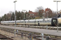 Ic3 trainset MFA 5016/MFB 5216 (named Hellig Anders) photographed in Struer 21. January 2007.  The Ic3 was built by ABB Scandia in Denmark. Each unit consists of 3 coaches. Built in a number of 92 trainsets. The trainsets were put in service in 1989 - 1998. 4 diesel engines of 294 kW per trainset. Max speed 180 km/h - 112 mph. Length 58 800 mm. Weight 97 metric tonnes. 16 seats 1st class, 128 seats 2nd class. Up to 5 trainsets can be put together. The MFA 5016/MFB 5216 was put in service in 1990.