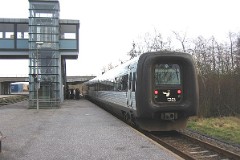 Ic3 trainset MFA 5003/MFB 5203 (named H. C. Andersen) photographed in Skive 21. January 2007.  The Ic3 was built by ABB Scandia in Denmark. Each unit consists of 3 coaches. Built in a number of 92 trainsets. The trainsets were put in service in 1989 - 1998. 4 diesel engines of 294 kW per trainset. Max speed 180 km/h - 112 mph. Length 58 800 mm. Weight 97 metric tonnes. 16 seats 1st class, 128 seats 2nd class. Up to 5 trainsets can be put together. The MFA 5003/MFB 5203 was put in service in 1989.
