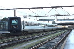 Ic3 trainset MFA 5081/MFB 5281 (named J.C.H. Ellehammer) photographed at the railwaystation i Fredericia, 19. Januar 2008.  The Ic3 was built by ABB Scandia in Denmark. Each unit consists of 3 coaches. Built in a number of 92 trainsets. The trainsets were put in service in 1989 - 1998. 4 diesel engines of 294 kW per trainset. Max speed 180 km/h - 112 mph. Length 58 800 mm. Weight 97 metric tonnes. 16 seats 1st class, 128 seats 2nd class. Up to 5 trainsets can be put together. The MFA 5003/MFB 5203 was put in service in 1993.