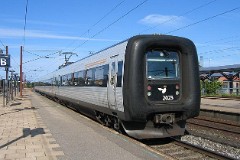 DSB IR4 ER2023 trainset photographed in Slagelse 4. August 2007.  The IR4 was built by ABB Scandia in Denmark. Each unit consists of 3 coaches. Built in a number of 44 trainsets. The trainsets were put in service in 1989 - 1998. 4 electric engines of 420 kW per trainset. Max speed 180 km/h - 112 mph. Length 76 530 mm. Weight 133 metric tonnes. 24/16 seats 1st class, 183/183 + 20 seats 2nd class. Up to 5 trainsets can be put together. IR4 2023 was put in service in 1995.