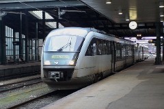 DSB Desiro MQ 4119/4919 trainset photographed at the railway station in Fredericia 12. December 2006. The MQ class is built by Siemens in Germany. DSB has leased 12 units primarily for the line Odense - Svendborg. The type is used widely in Germany. The trainsets were put in service in Denmark in 2002. Two diesel engines of 315 kW per trainset. Max speed 120 km/h - 75 mph. Length 41 700 mm. Weight 68,2 metric tonnes. 114 seats 2nd class. Up to 3 trainsets can be put together.