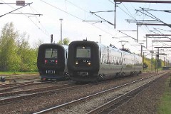 The "Øresundstog" DSB ET 4314 and ET 4357 trainset photographed in Røde Kro 14. May 2005.  The trainset is built by Adtranz, Sweden (Bombardier Transportation). It is purchased in corporation between SJ, Sweden and DSB, Denmark. The trainsets are in operation between Sjælland in Denmark and southern Sweden via the bridge over Øresund. Each unit consists of 3 coaches. The trainsets was put in service in 2000 - 2003. Electric. 2.120 kW. Max speed 180 km/h - 112 mph. Length 78 900 mm. Weight 153 metric tonnes. 20 seats 1st class, 217 seats 2nd class. Up to 5 trainsets can be put together.