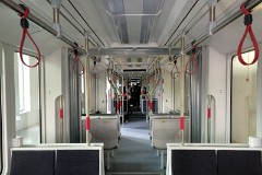 Stadler Variobahn, photographed at the work shop of Midttrafik in Aarhus, 8. October 2016.  This type will be delivered in a number of 14 . It has a maximum speed of 80 km/h. The new tram line is supposed to be ready for operation in 2017. The tram line transforms two existing railways - Odderbanen and the Grenaa railway - to an electric light rail. The two lines will be connected via a new track from Lystrup, Skejby, Randersvej, the urban harbor and Aarhus Central Station.