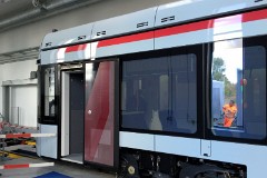 Stadler Variobahn, photographed at the work shop of Midttrafik in Aarhus, 8. October 2016.  This type will be delivered in a number of 14 . It has a maximum speed of 80 km/h. The new tram line is supposed to be ready for operation in 2017. The tram line transforms two existing railways - Odderbanen and the Grenaa railway - to an electric light rail. The two lines will be connected via a new track from Lystrup, Skejby, Randersvej, the urban harbor and Aarhus Central Station.