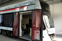 Stadler Variobahn, photographed at the work shop of Midttrafik in Aarhus, 8. October 2016.  This type will be delivered in a number of 14 . It has a maximum speed of 80 km/h. The new tram line is supposed to be ready for operation in 2017. The tram line transforms two existing railways - Odderbanen and the Grenaa railway - to an electric light rail. The two lines will be connected via a new track from Lystrup, Skejby, Randersvej, the urban harbor and Aarhus Central Station.